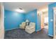 Relaxing den with blue walls and two armchairs at 4027 Davit Dr, New Port Richey, FL 34652