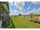 Landscaped backyard with a view of the lake at 5429 Rainwood Meadows Dr, Apollo Beach, FL 33572