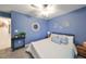 Blue bedroom with a ceiling fan and natural light at 5429 Rainwood Meadows Dr, Apollo Beach, FL 33572