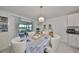 Bright dining room with table and chairs, leading to a patio at 5429 Rainwood Meadows Dr, Apollo Beach, FL 33572