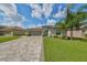 Single-Gathering home with paver driveway and landscaping at 5429 Rainwood Meadows Dr, Apollo Beach, FL 33572