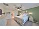 Main bedroom with a king-size bed, dresser, and a view into the en-suite bathroom at 5429 Rainwood Meadows Dr, Apollo Beach, FL 33572