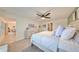 Spacious main bedroom with king-size bed and views of the dining room at 5429 Rainwood Meadows Dr, Apollo Beach, FL 33572