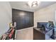 Home office with dark-paneled accent wall at 5429 Rainwood Meadows Dr, Apollo Beach, FL 33572