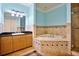 Bathroom with soaking tub, shower, and granite vanity at 700 N Osceola Ave # 702, Clearwater, FL 33755