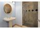 Clean bathroom with pedestal sink, and a large walk-in shower at 700 N Osceola Ave # 702, Clearwater, FL 33755