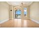 Bedroom with hardwood floors, arched windows, and access to balcony at 700 N Osceola Ave # 702, Clearwater, FL 33755