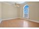 Bright bedroom featuring hardwood floors and arched window at 700 N Osceola Ave # 702, Clearwater, FL 33755