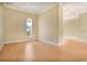 Spacious bedroom with hardwood floors and arched window at 700 N Osceola Ave # 702, Clearwater, FL 33755