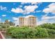 Luxury waterfront building with lush landscaping at 700 N Osceola Ave # 702, Clearwater, FL 33755