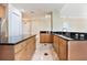 Kitchen with wood cabinets and granite countertops at 700 N Osceola Ave # 702, Clearwater, FL 33755