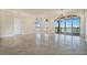 Large living room with tile floors and access to balcony at 700 N Osceola Ave # 702, Clearwater, FL 33755