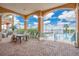 Resort-style pool deck with seating and tables, overlooking the water at 700 N Osceola Ave # 702, Clearwater, FL 33755