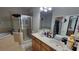 Bathroom boasts double sinks, a soaking tub, and a shower at 12820 Belvedere Song Way, Riverview, FL 33578