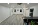 Bright living room with vinyl flooring and ceiling fan at 1574 Ewing Ave, Clearwater, FL 33756