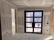 Interior view of an entryway with a modern black metal door at 3403 W Leona St, Tampa, FL 33629