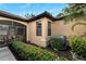 Well-maintained home exterior with landscaping and screened patio at 242 Shell Falls Dr, Apollo Beach, FL 33572