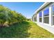 Landscaped backyard with lush greenery and privacy at 6179 Hidden Branch Dr, Apollo Beach, FL 33572