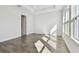 Bedroom with wood-look floors and door to bathroom at 6179 Hidden Branch Dr, Apollo Beach, FL 33572