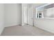 Spacious bedroom with neutral carpeting and an open feel at 6179 Hidden Branch Dr, Apollo Beach, FL 33572