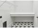 Laundry room with built-in shelving and stylish tile floor at 6179 Hidden Branch Dr, Apollo Beach, FL 33572