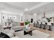 Open concept living room, kitchen, and dining area at 6179 Hidden Branch Dr, Apollo Beach, FL 33572