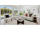 Relaxing living room with view of backyard and plenty of natural light at 6179 Hidden Branch Dr, Apollo Beach, FL 33572