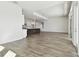Open concept living area with kitchen island and sliding glass doors at 6179 Hidden Branch Dr, Apollo Beach, FL 33572