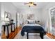 Spacious bedroom with hardwood floors, and a comfortable bed at 120 W Hiawatha St, Tampa, FL 33604