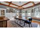 Bright dining room with stained glass windows and wood beams at 1005 Main St, Safety Harbor, FL 34695