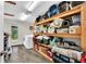 Well-organized laundry room with shelving and washer/dryer hookups at 10824 Palmetto St, Riverview, FL 33569