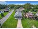 House with a driveway and a green lawn, aerial view at 1311 E Church St, Plant City, FL 33563