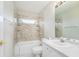 Clean bathroom with tub shower, vanity, and updated finishes at 8929 Cashella Ct, Trinity, FL 34655