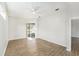 Well-lit bedroom with wood-look floors and sliding glass doors at 8929 Cashella Ct, Trinity, FL 34655