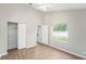 Bright bedroom with wood-look floors and spacious closet at 8929 Cashella Ct, Trinity, FL 34655