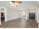 Spacious living area with wood-look floors and a view into the kitchen at 8929 Cashella Ct, Trinity, FL 34655