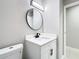 Modern bathroom with vanity, toilet, and mirror at 2229 Arch Mcdonald Dr, Dover, FL 33527