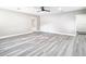 Bright living room with grey wood-look floors at 2229 Arch Mcdonald Dr, Dover, FL 33527