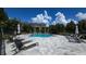 A community pool that is surrounded by comfortable lounge chairs for residents to relax at 2947 Bayshore Pointe Dr, Tampa, FL 33611