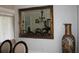 Reflective mirror and decorative vase accentuate the dining room at 5909 Menorca Ln, Apollo Beach, FL 33572