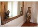 Large ornate mirror reflects light into the dining area at 5909 Menorca Ln, Apollo Beach, FL 33572