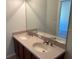 Bathroom with double sink vanity, large mirror, and neutral color palette at 8504 Brushleaf Way, Tampa, FL 33647