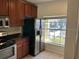 Bright kitchen featuring stainless steel appliances and a window with a view at 8504 Brushleaf Way, Tampa, FL 33647