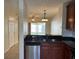 Kitchen area has stainless steel dishwasher, nice countertops and a sink at 8504 Brushleaf Way, Tampa, FL 33647