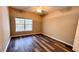 Cozy bedroom featuring a window with natural light and wood grain flooring at 4207 S Dale Mabry Hwy # 12204, Tampa, FL 33611