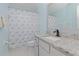 Bathroom with granite countertop, single vanity, and seashell shower curtain at 4224 Fleewell Ct, Valrico, FL 33596