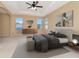 Elegant bedroom showcasing tray ceilings, neutral walls, and ample natural light from multiple windows at 4224 Fleewell Ct, Valrico, FL 33596