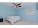 Light blue bedroom with a ceiling fan and window blinds at 4224 Fleewell Ct, Valrico, FL 33596