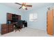 Bright bedroom with built-in desk and ample space for work and rest at 4224 Fleewell Ct, Valrico, FL 33596