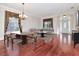 Bright dining room featuring hardwood floors, a large table, and chandelier at 4224 Fleewell Ct, Valrico, FL 33596